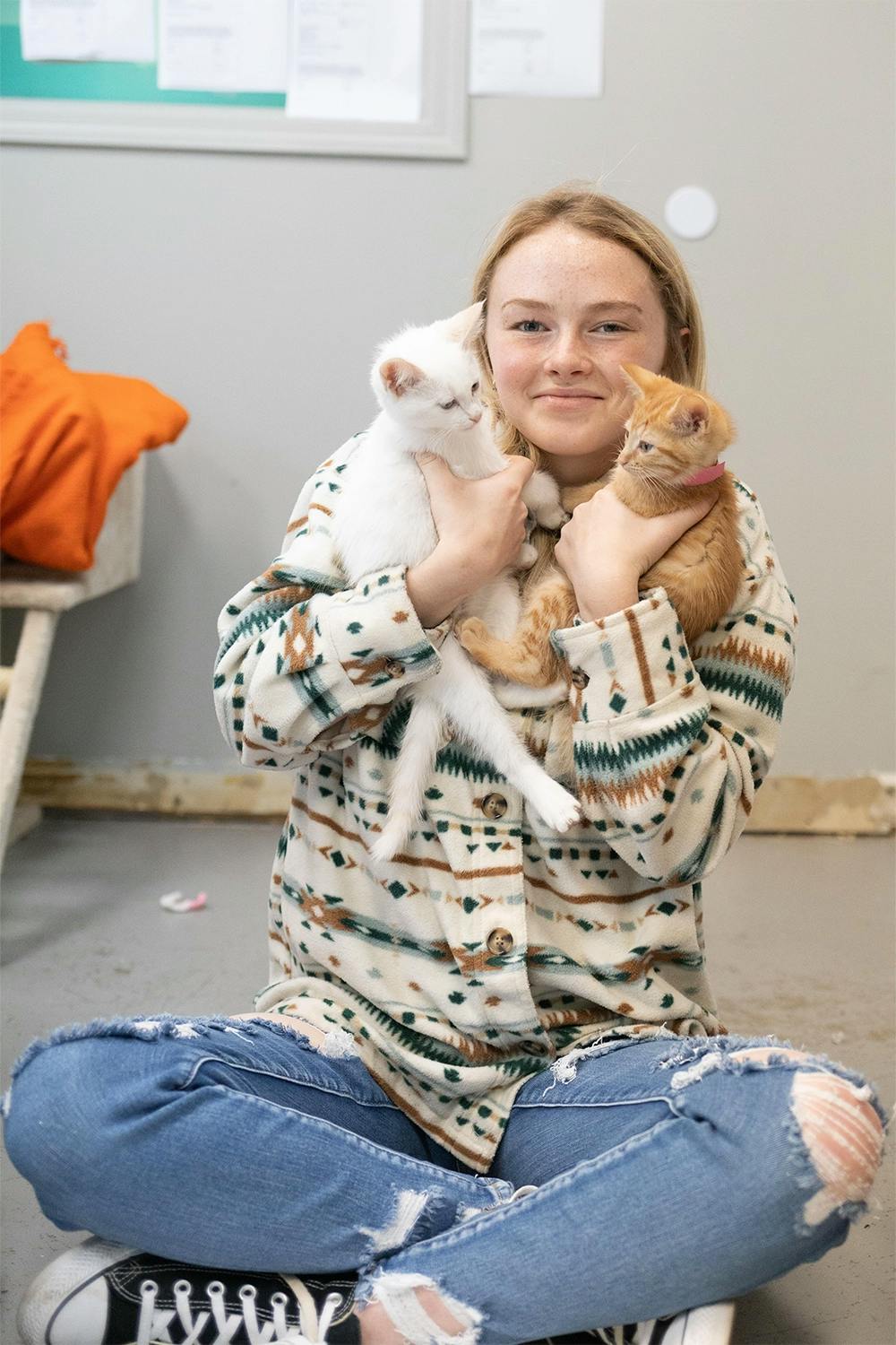 Volunteer Holding Two Kittens